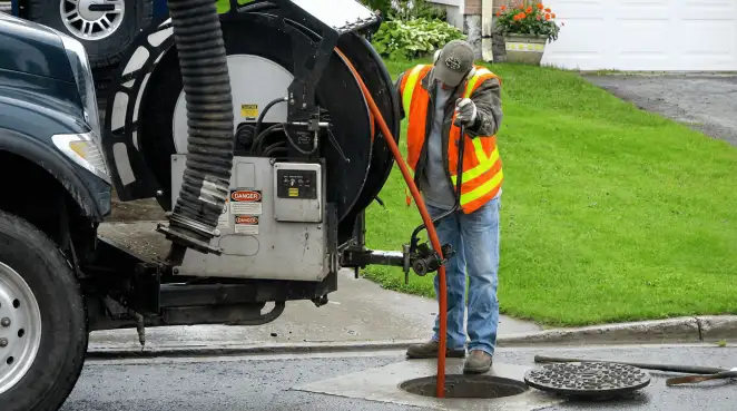 Technician using specialized drainage equipment for sewer line cleaning and foundation protection in Stamford, CT