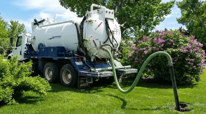 Professional vacuum truck performing residential drainage and septic maintenance in Stamford, CT